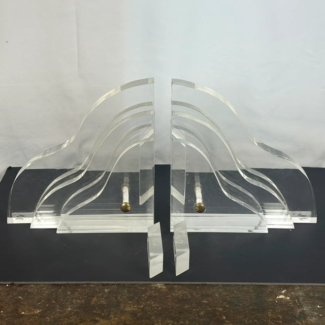Vintage Lucite Wall Brackets with Lucite mounts attributed to Karl Springer or similar maker. These are substantial and...