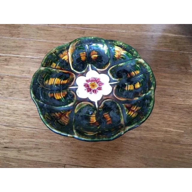 Very nice antique majolica compote or centerpiece with a bird (heron or stork?) at the base. The top or "bowl" of the...