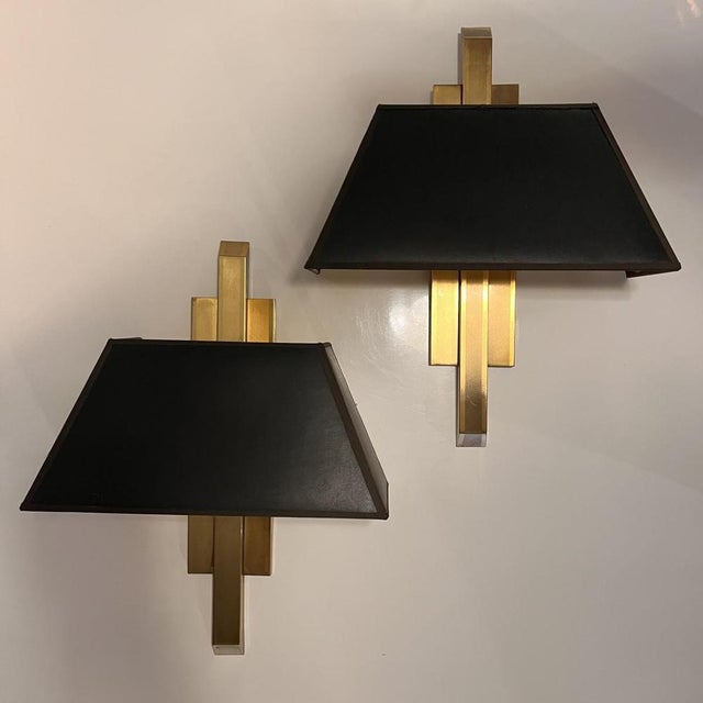 Pair of gilded brass wall lights with black fabric shades created by deknudt in belgium, hollywood rengency style circa...