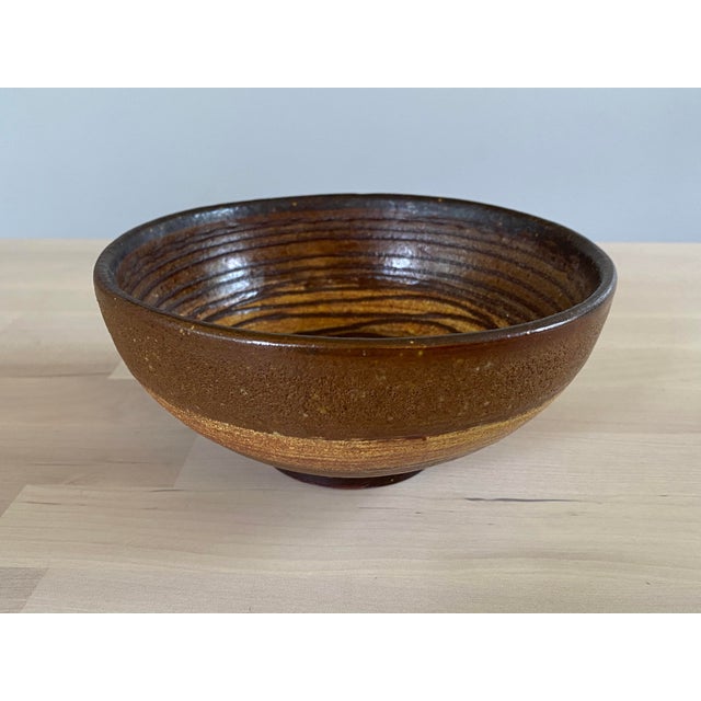 A very cool, early 1950s pottery bowl by Lee Rosen for Design-Technics. This modern bowl features a raised slip decorated...