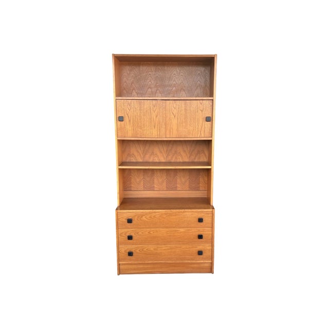 This striking 1960s Danish Modern bookcase cabinet has been fully professionally restored and newly finished in a warm...