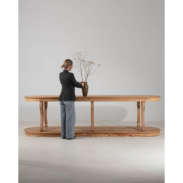 Here is a dining table, its natural bleached oak, elongated octagonal top the first thing to catch the eye. It was made in...