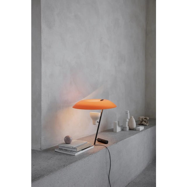 Model 548 design by gino sarfatti the table lamp designed in 1951 is a study in balance and light reflection through a...