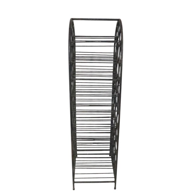 Classic later mid century wine rack, constructed of iron, and wrought iron having 39 circular wine bottle holders within...