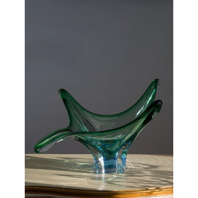 An elegant Murano glass centerpiece, crafted between the 1960s and 1970s, during the Midcentury Modern period. Made using...