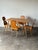 This vintage dining set pairs a rectangular oak table with four matching Stabelle chairs, both built on the same splayed,...