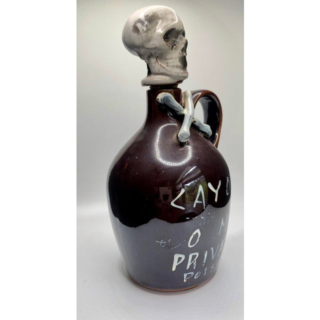Skull and Bones Poison Rum Bottle Decanter from the 1950s This is a hand-crafted ceramic decanter that features a unique...
