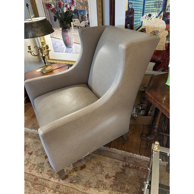 Beautifully made Lee Industries custom taupe grey leather club chair having a high back with sleek wing chair silhouette....