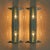 A pair of 1960s Italian sconces crafted in the manner of Fontana Arte, defined by their architectural chrome fittings and...