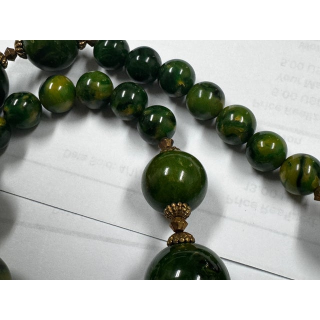 1950s Bakelite Pendant Necklace With Green and Yellow Marbled Beads and a Gold Tone Monkey Pendent Holding Beads Excellent Pre Owned Condition For Sale - Image 12 of 12