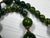 1950s Bakelite Pendant Necklace With Green and Yellow Marbled Beads and a Gold Tone Monkey Pendent Holding Beads Excellent Pre Owned Condition For Sale - Image 12 of 12
