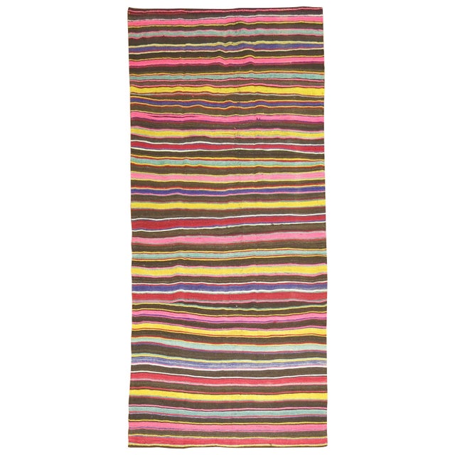 A vintage Turkish Kilim gallery size rug from the middle of the 20th century.