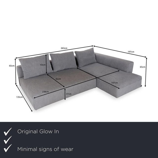 The Glow In sofa is covered in a dark gray fabric and is floor-to-ceiling. The corner sofa is characterized by its...
