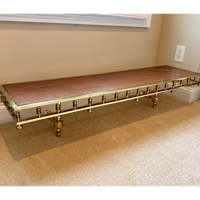Need a little extra serving space in your dining room? This brass framed wood topped shelf offers just that without taking...