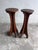 A sculptural pair of French wooden pedestal stands dating from the early 20th century. Each piece features a circular top...