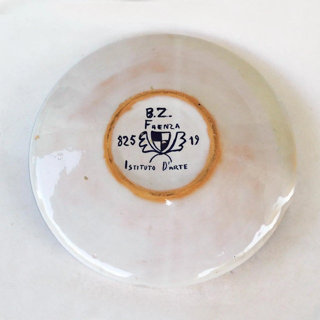 Vintage polychrome enamelled Centerpiece branded Art Institute of Faenza. Diameter: 26.5 cm.