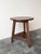 This antique late 19th-century Welsh cricket table features a classic circular top, showcasing a rich, aged scumble-...