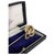 A Victorian 9ct yellow gold novelty stickpin modelled as a coiled serpent. The serpent's head is set with a cushion-cut...