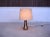 This Danish Modern table lamp was made in the 1960s. It features a glazed ceramic base in warm sand, beige and brown...