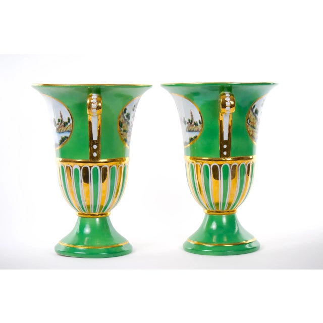 Pair of antique early 20th century Paris porcelain vases with scrolling handles, extensive gilding and oval cartouches...