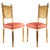Pair of French Art Deco giltwood side chairs, circa 1930s, featuring elegantly carved backs with stylized draped swag...