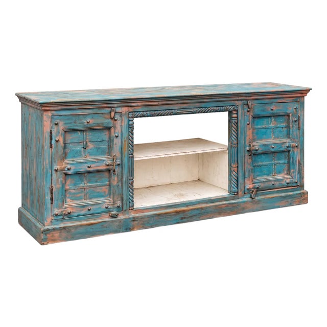 This painted credenza has been hand crafted out of 19th century French architectural elements. It could work as a media...