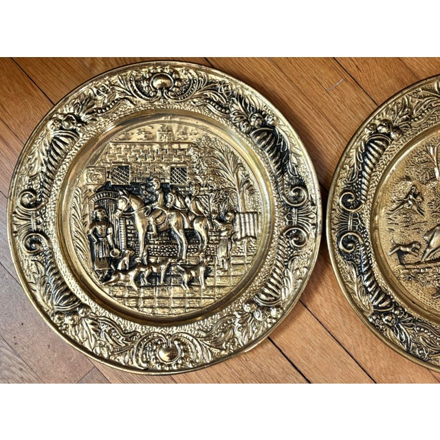 In the English Traditional style, these vintage heavily embossed brass plates depict two equestrian hunt scenes with dogs....