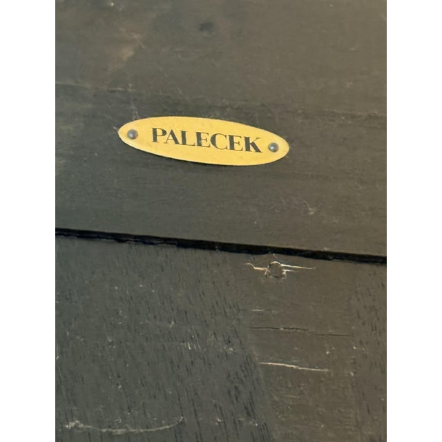 Elegant vintage Palecek armoire featuring a dark wood frame with beautifully woven rattan front door panels and...