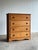 This vintage four drawer dresser features softly framed drawer fronts, turned wooden pulls, and a gently shaped apron base...