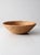 This vintage hand-coiled basket bowl showcases tightly stitched spiral construction and a softly rounded silhouette,...