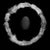 Nature still life of a circle of feathers with a black stone in the center on a black background Unframed Feather Rock -...