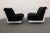 A pair of armchairs made in Italy in the 1970s. The furniture was inspired by Mario Bellini's design. The armchairs have...
