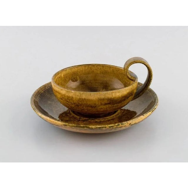 Kähler, Denmark. Egoist tea set in glazed stoneware. Beautiful yellow uranium glaze. Mid-20th century. Consisting of a...