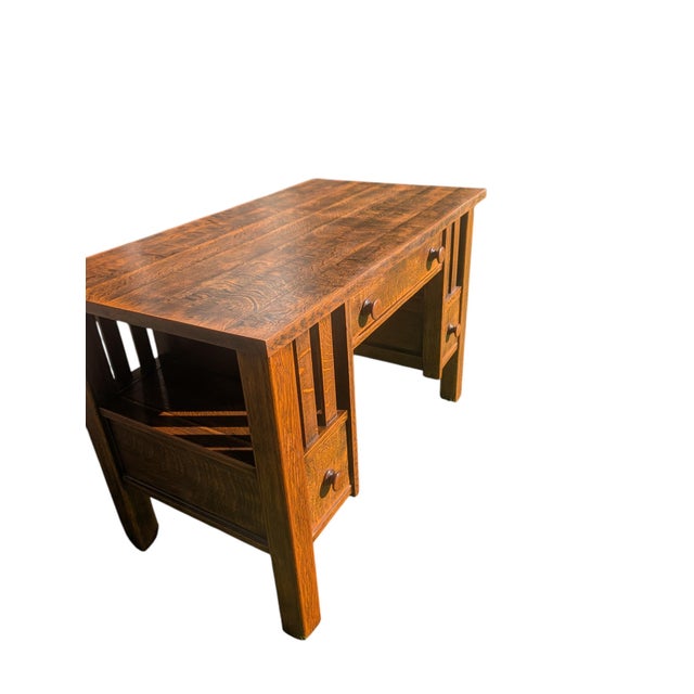 An exceptional early 20th-century American Arts & Crafts / Mission Style kneehole desk, crafted from dense, solid...