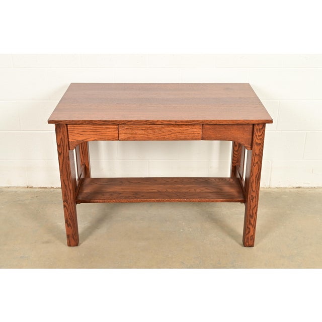 A gorgeous antique Mission oak Arts & Crafts writing desk or library table In the manner of Stickley Brothers USA, Circa...