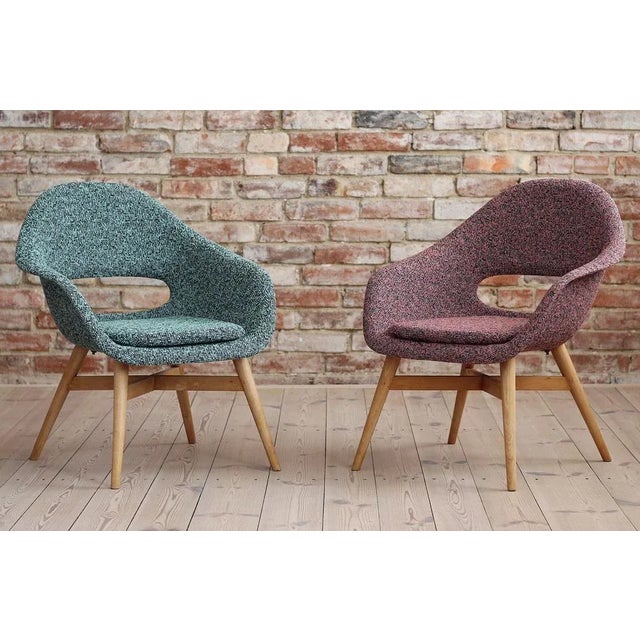This Set of 2 Lounge Chairs was designed in 1950s by Miroslav Navrátil in Czech Republic. It features a fiberglass seating...
