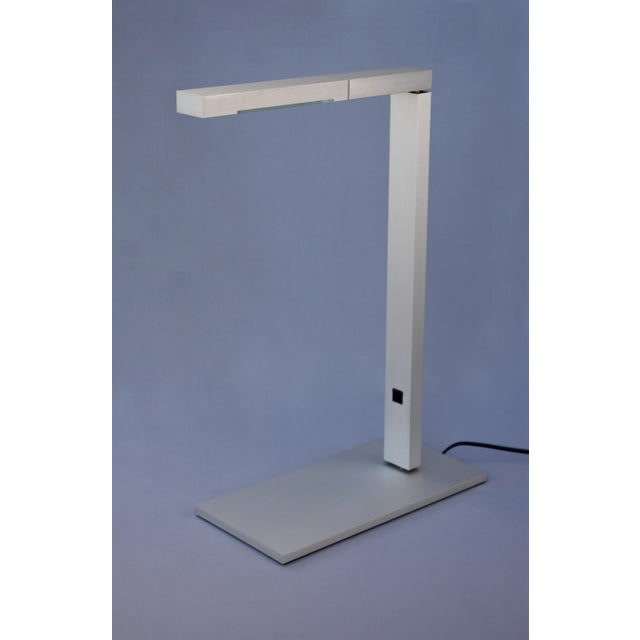 Architectural DKB table lamp designed in 1999 by Danish studio Schmidt Hammer Lassen Architects and manufactured by Louis...