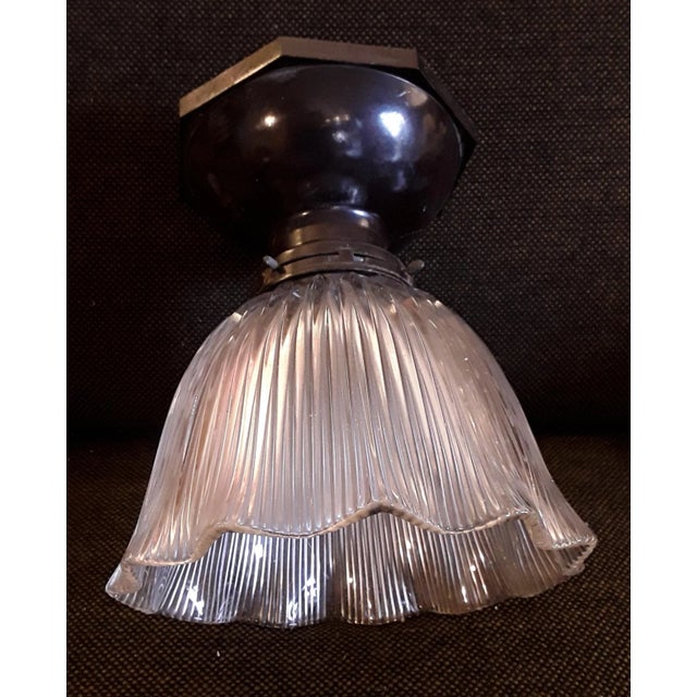 Antique Flat Ceiling Lamp with Ribbed Glass Shade and Brown Bakelite Mount, 1920s, in Good conditions. Designed 1920 to...