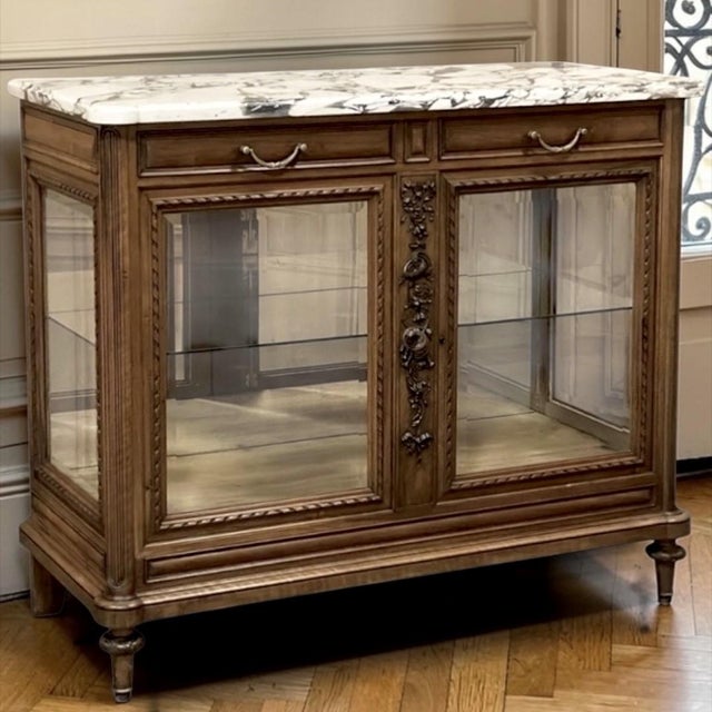 Found in Paris, this 19th century French buffet was crafted in walnut in a beautifully revived Louis XVI style, drawing...