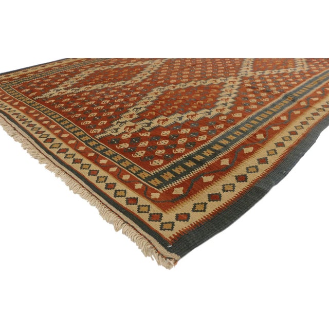 77294 Vintage Persian Kilim Rug, 06'06 x 11'09. Persian kilim rugs originate from Iran and are known for their traditional...