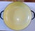 This yellow enamelware piece has seen better days & is in "fair" condition, as the glaze is marked from wear. You can cook...