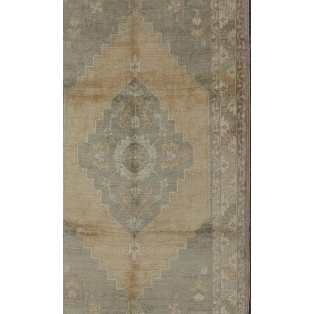 Keivan Woven Arts, En-721, Muted mid-20th century vintage Oushak rug with medallion in camel, Keivan Woven Arts / rug...