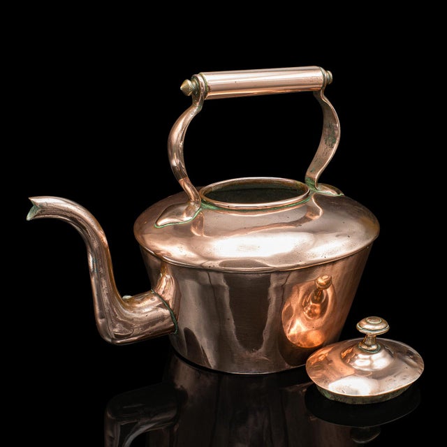 This is an antique scullery kettle. An English, copper stovetop teapot, dating to the Victorian period, circa 1870....