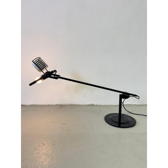 Beautiful 1970s table lamp, designed by Ernesto Gismondi and produced by the Italian company Artemide. Metal frame, fully...