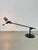 Beautiful 1970s table lamp, designed by Ernesto Gismondi and produced by the Italian company Artemide. Metal frame, fully...