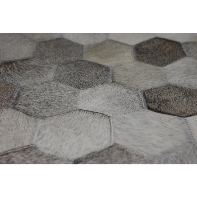 Modern elegance meets artisan craftsmanship in this 16 x 24 inch genuine cowhide leather lumbar pillow, meticulously...