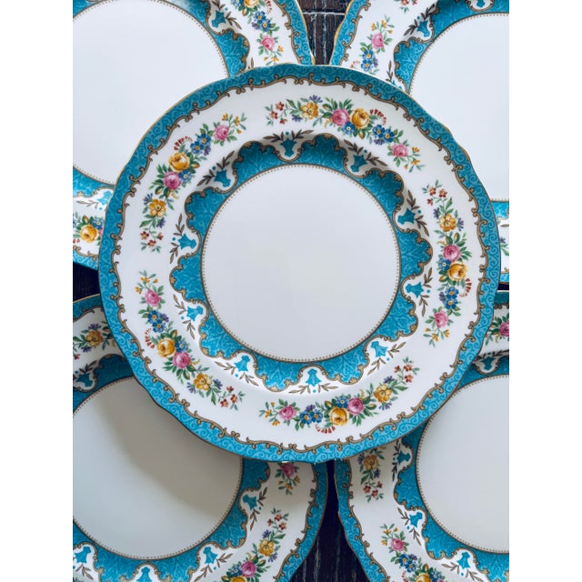 A beautiful set of six vintage Crown Staffordshire fine bone china dinner plates in the Lyric Tunis Blue pattern, made in...