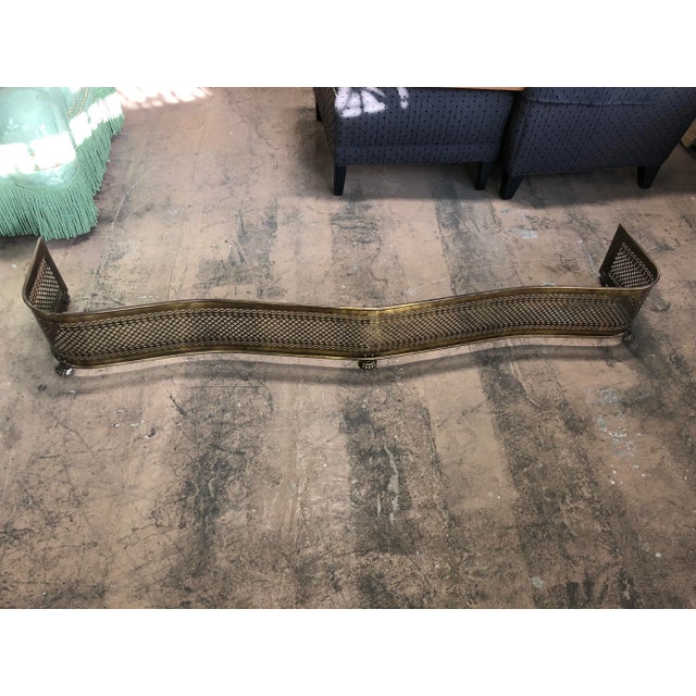 Spectacular doesn’t do this piece all the justice it deserves. Made for a large fireplace this antique brass fireplace...