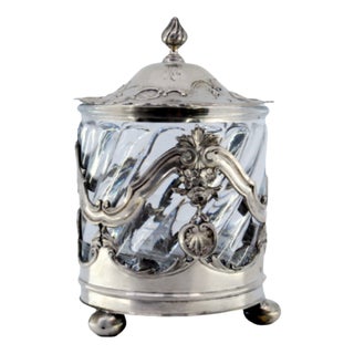 Silver Bonbon Box with a Cut Glass Core and Relief with Flowers and Plant Motifs and Supported by Three Round Feet. For Sale