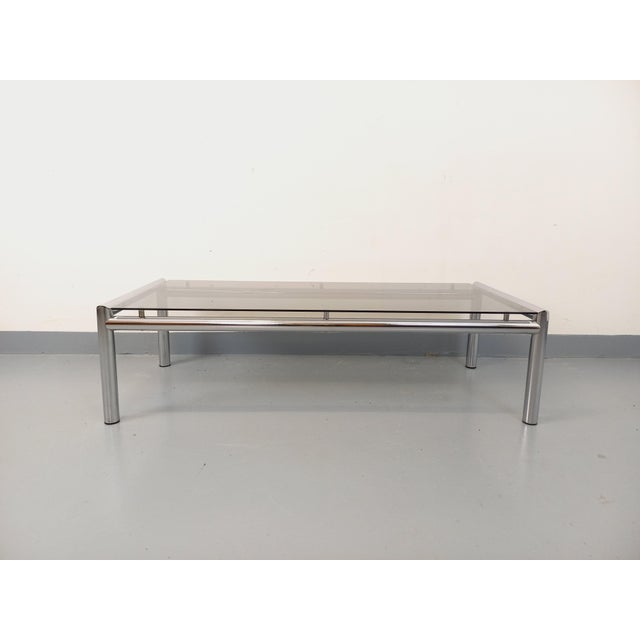 Large vintage coffee table from the 1970s, beautiful clean design, rectangular smoked glass top, tubular chrome metal...